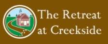 The Retreat at Creekside LLC Logo