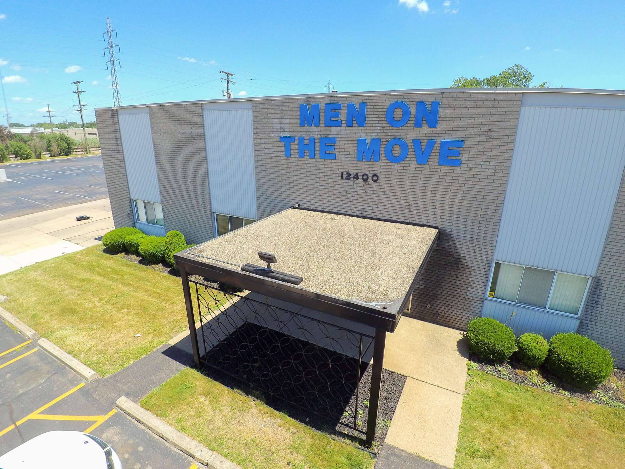 Men On The Move, Inc. / Wayne Logo