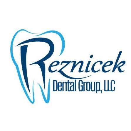 Reznicek Dental Group LLC Logo