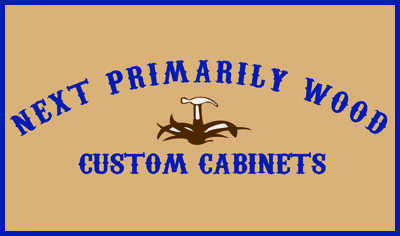 Next Primarily Wood Cabinets Logo