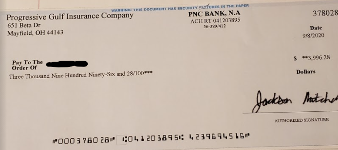 Redacted check from gift card payment scammer