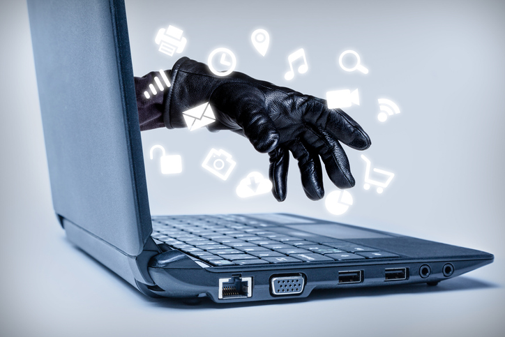 image of laptop with gloved hand reaching out, surrounded by social media and other online icons