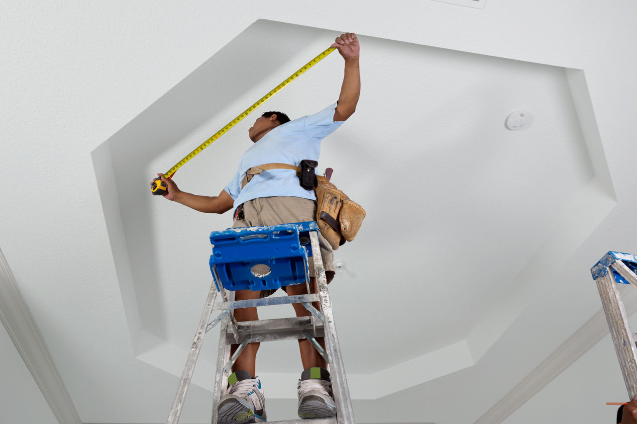 carpenters installing crown molding