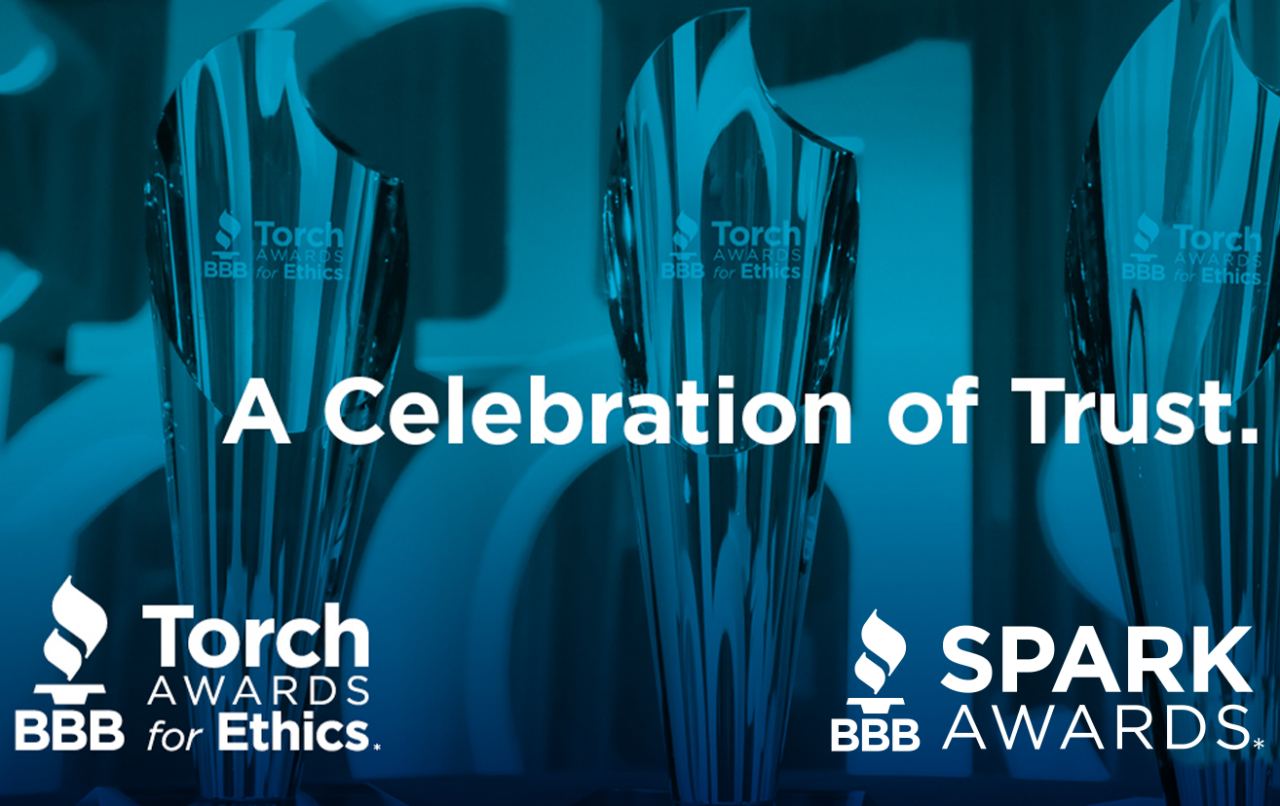 A web banner containing BBB Torch and Spark Award logos with awards in the background.