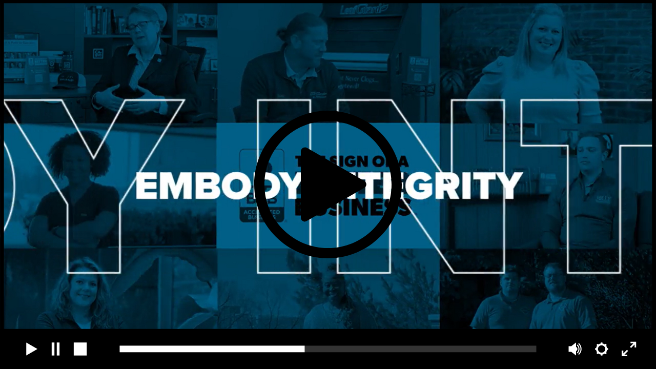 blue overlay with text "embody integrity" and video play button