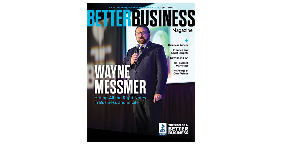 bearded man with a microphone with the caption wayne messmer and the title better business magazine in blue and black