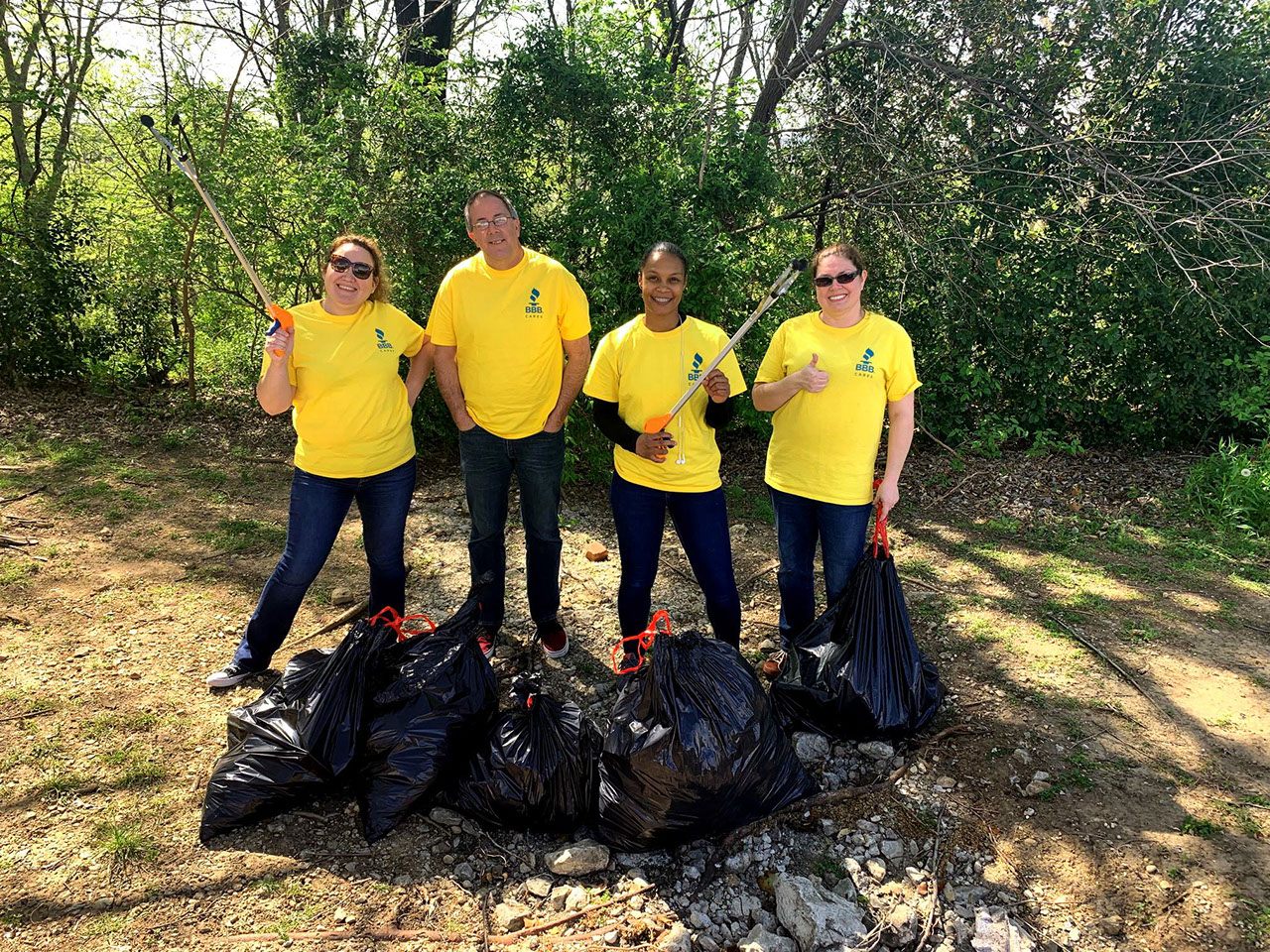 BBB serving the Heart of Texas staff picking up trash.